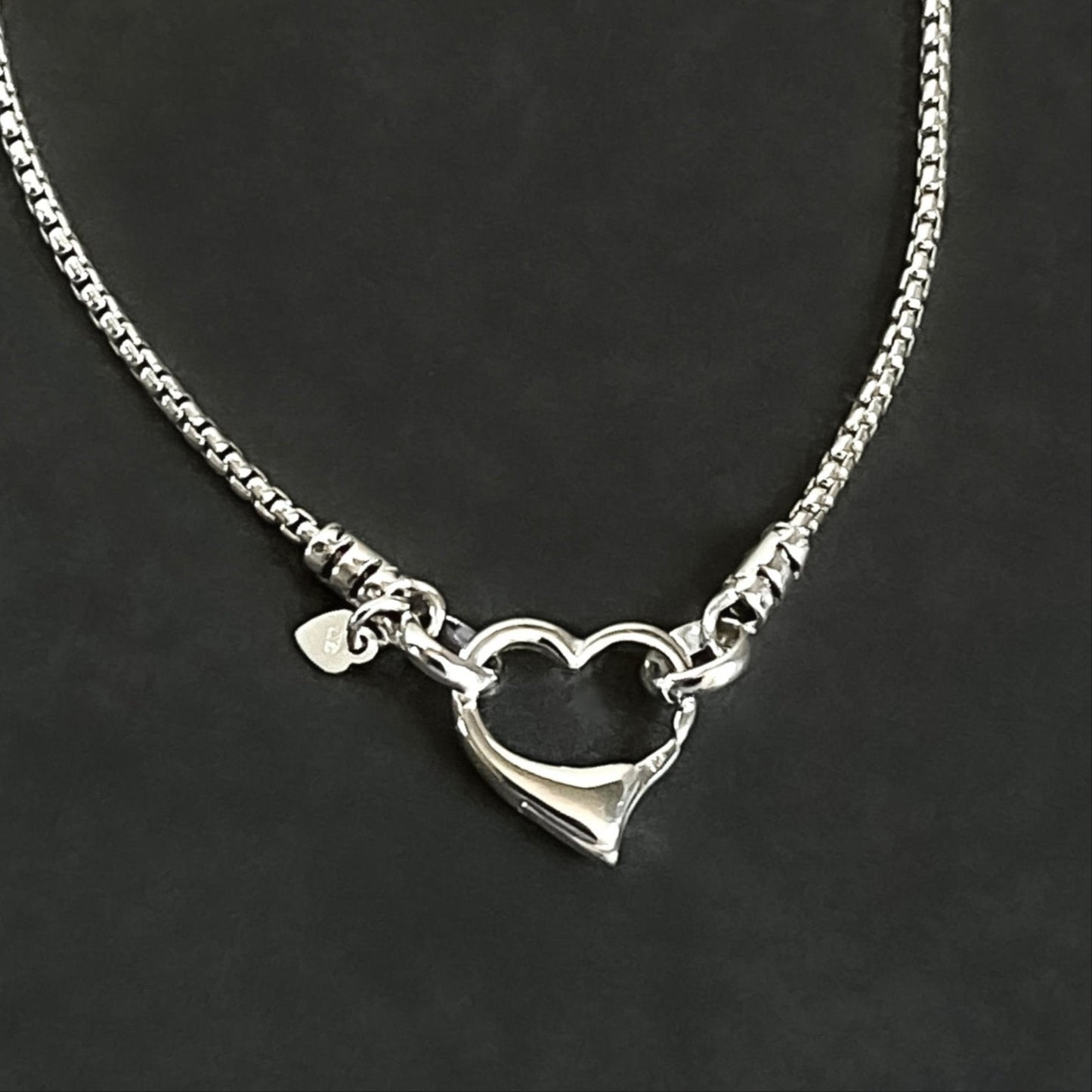 open heart clasp front closure attached to sterling silver rounded box chain