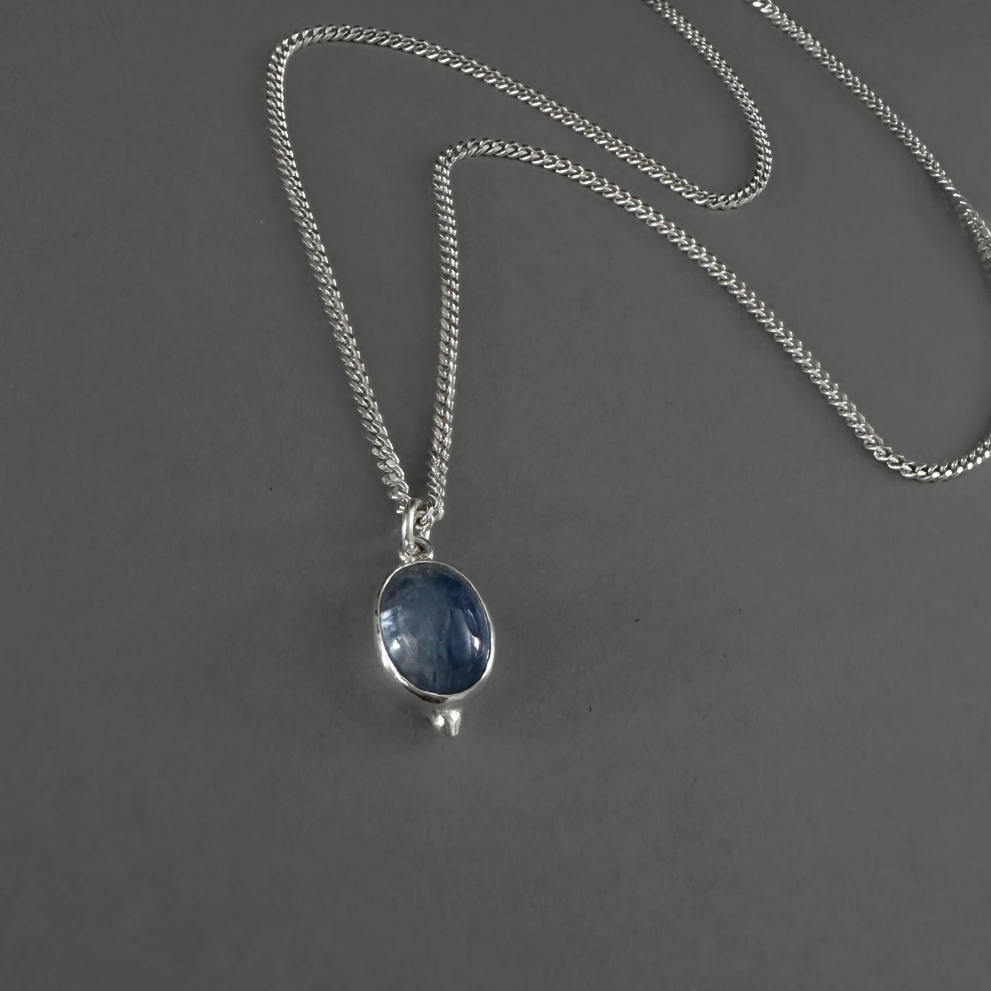 sterling silver curb chain with blue kyanite pendant
