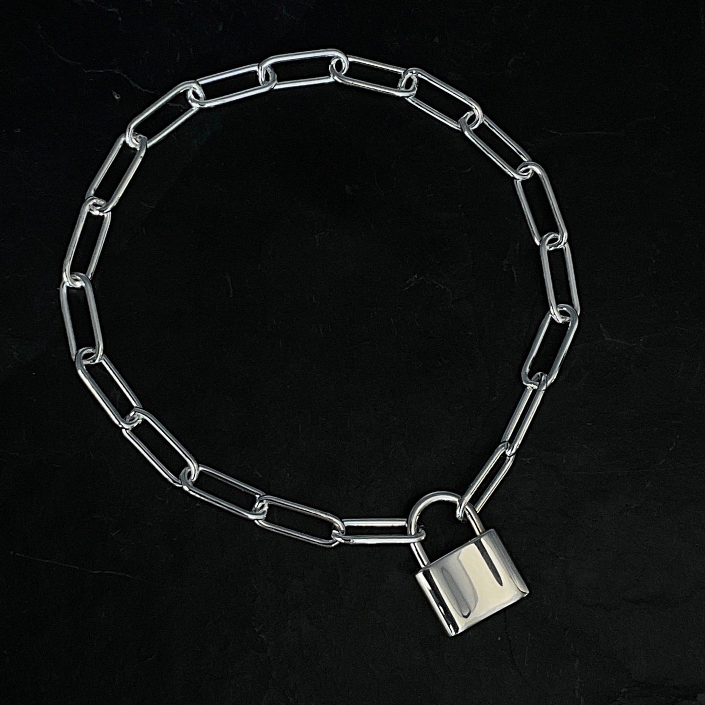 solid sterling silver paperclip chain bracelet 4.3mm width with a solid sterling silver padlock clasp 15 x 12 mm