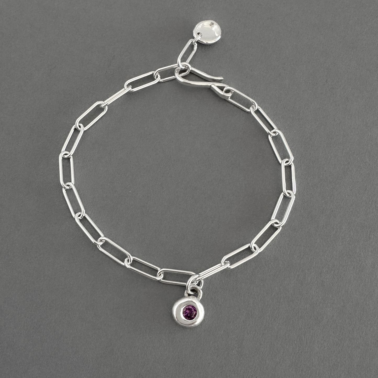 Silver chain bracelet with small round  amethyst charm