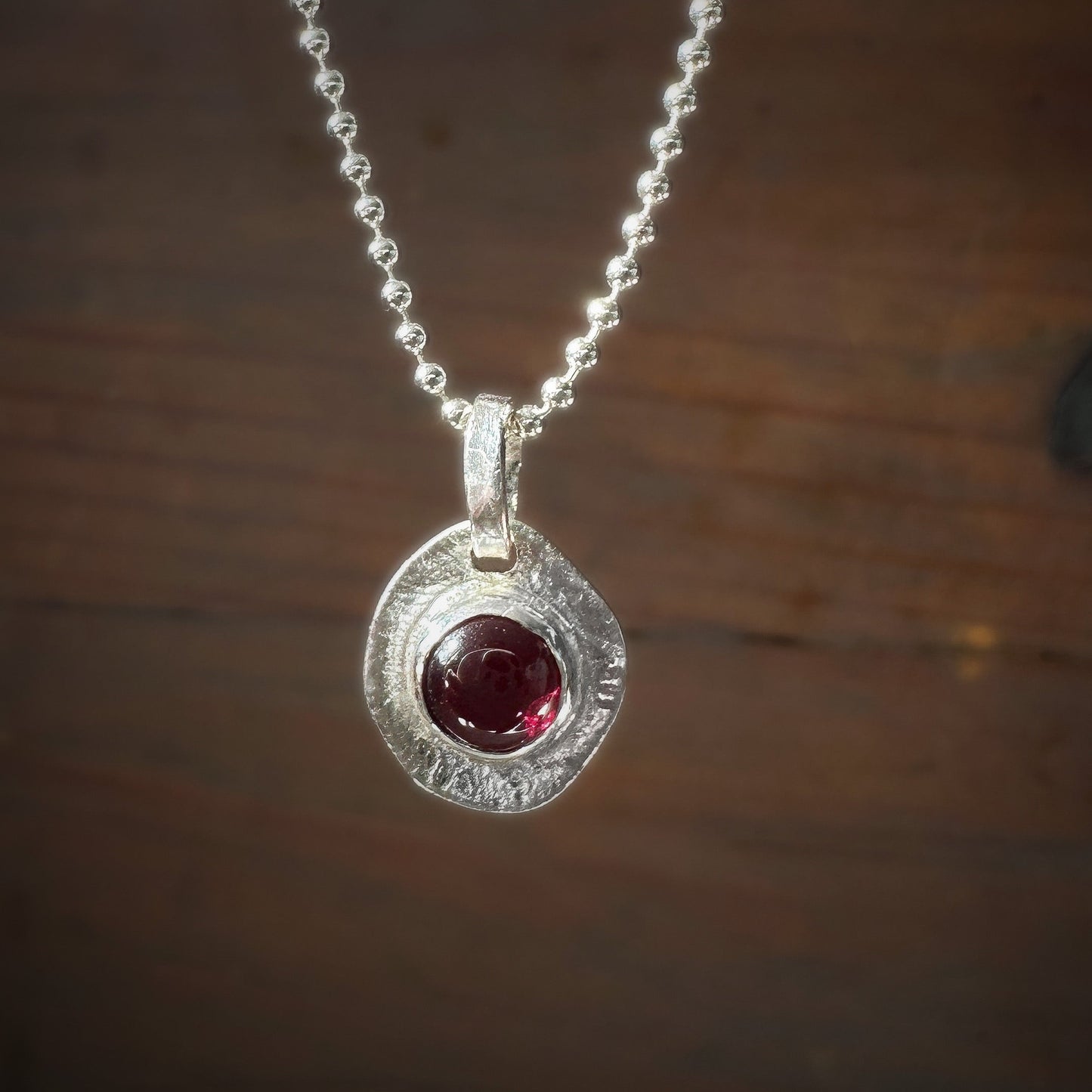 garnet pendant textured backing sterling silver necklace