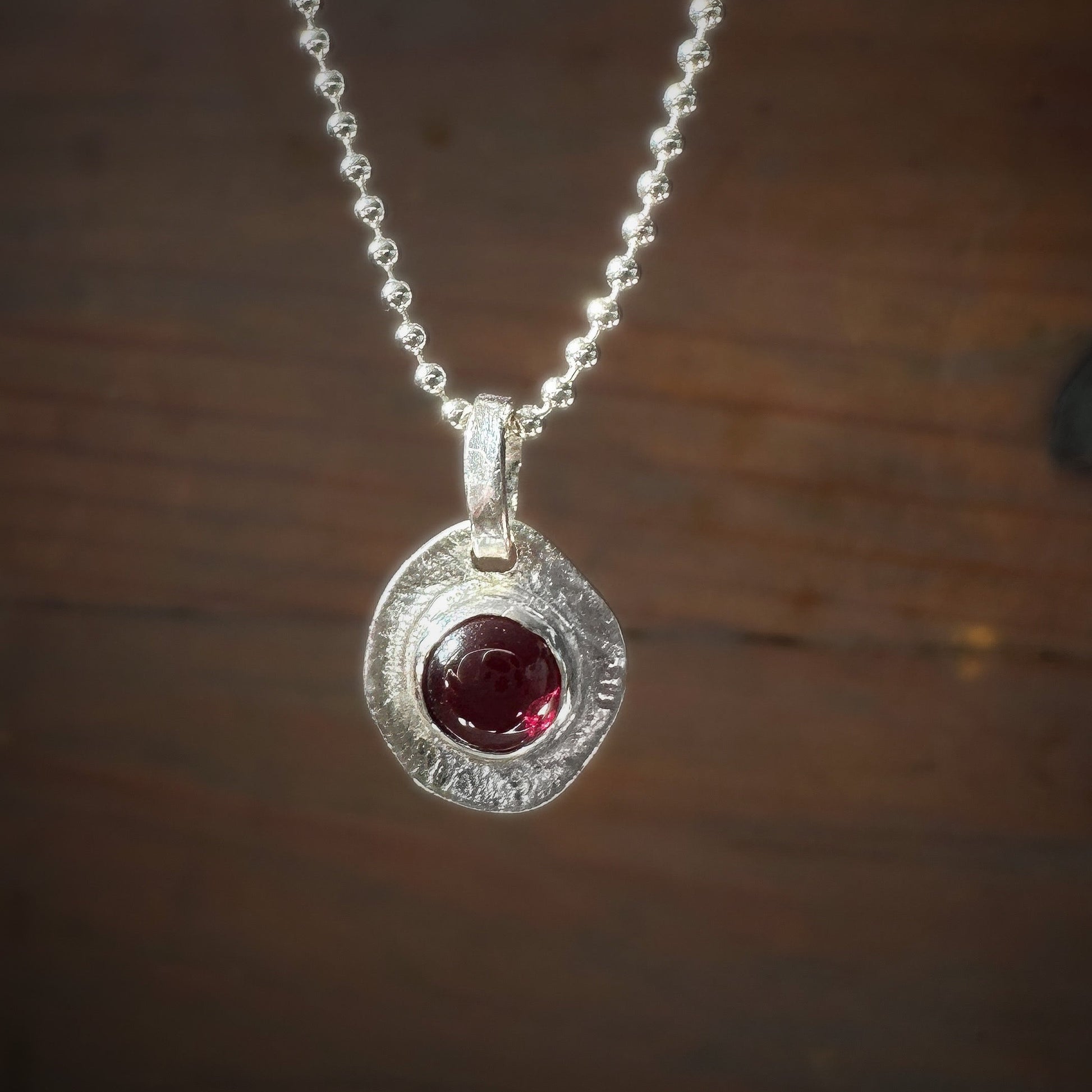garnet pendant textured backing sterling silver necklace
