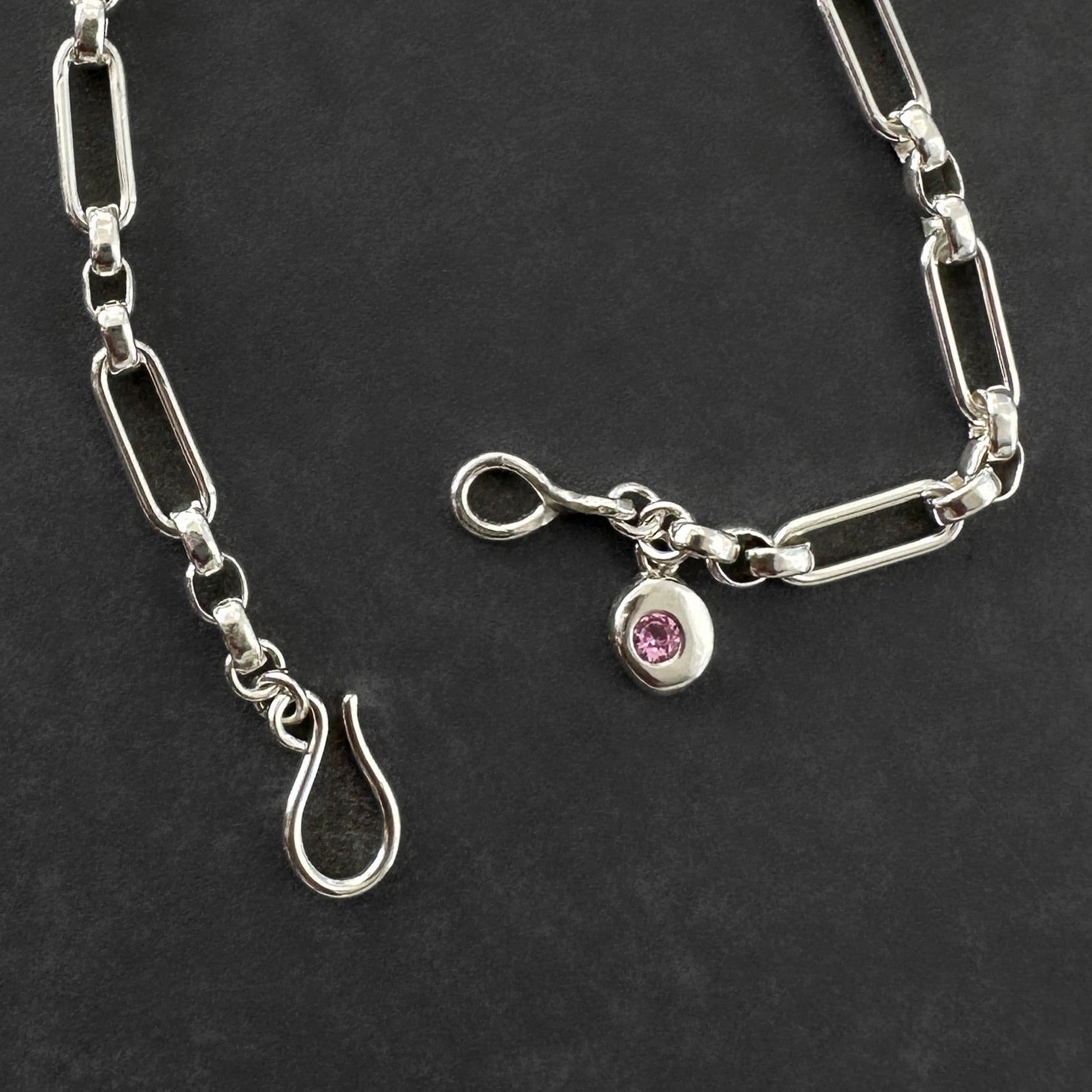 Silver chain bracelet with a pink tourmaline gemstone charm